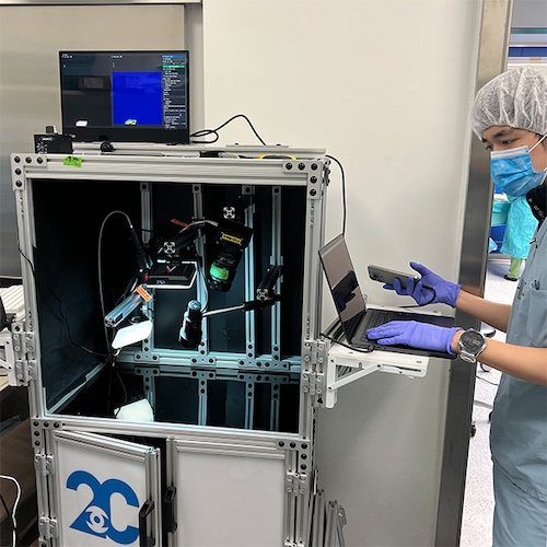 The new chip-based camera system can help surgeons identify lymph nodes connected to a tumor while also providing clues as to whether cancer has spread to them. In the image, they are using the system to examine breast cancer tissue. Credit: Viktor Gruev, UIUC.