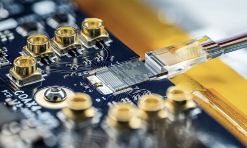 Optical fiber attached to a photonic chip on a circuit board at PsiFactory in Milpitas, California. Photo: PsiQuantum.