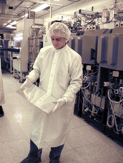 Vertical in-line fabrication The vertical in-line OLED display fabrication system