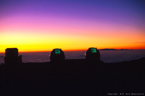 Two black holes have been pinpointed at the center of a collision of two galaxies thanks to adaptive optics at the Keck Observatory.