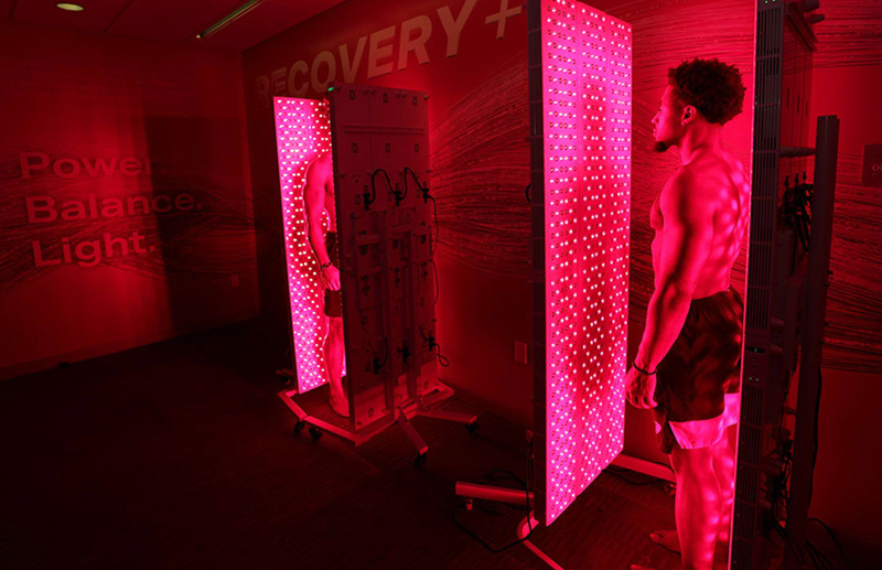 Red and red: 49ers Fred Warner and K’Waun Williams using light therapy room. 