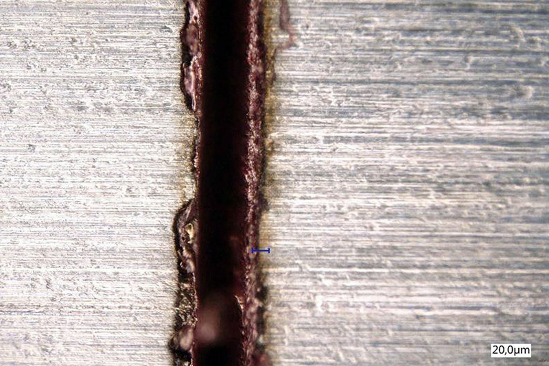 Kerf produced by helical cutting on a metal sheet. 