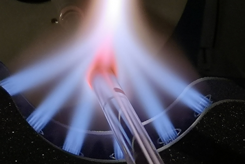 Fire in the hole: Hollowcore NANF fiber in manufacture. 