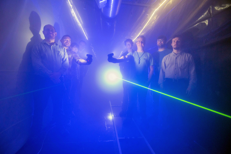 Foggy notions: Members of Sandia’s fog chamber research team inside the facility.