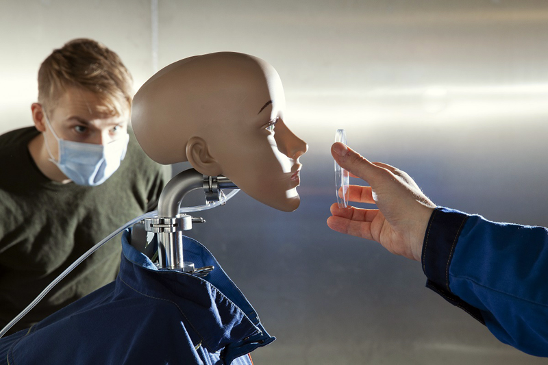 The robot coughs out a precise, repeatable cloud of droplets and aerosols. 