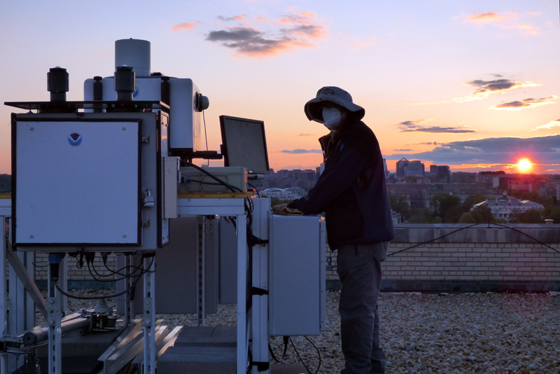 NOAA's Scott Sandberg beside the new lidar system.