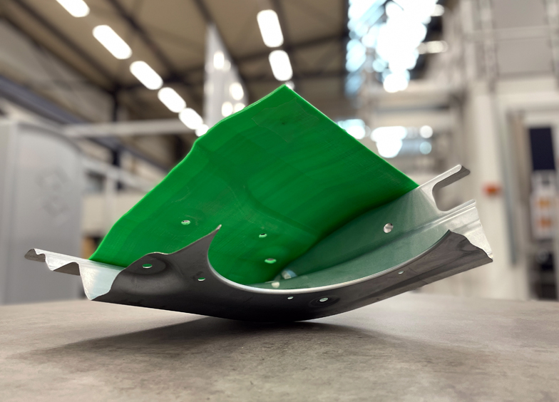 The process joins thermoplastic to metal on a Volkswagen door demonstrator.