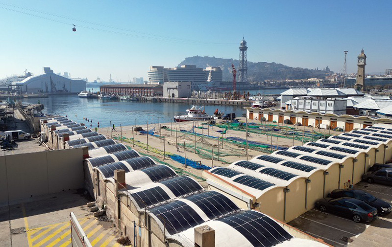 Barcelona port facilities with HeliaSol glued to undulating rooftops.