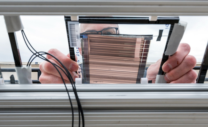 Installing a PACT minimodule at the Outdoor Test Facility at NREL.