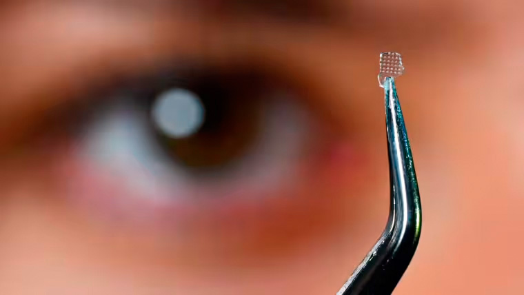 An optical lens made from “hybrid” glass.