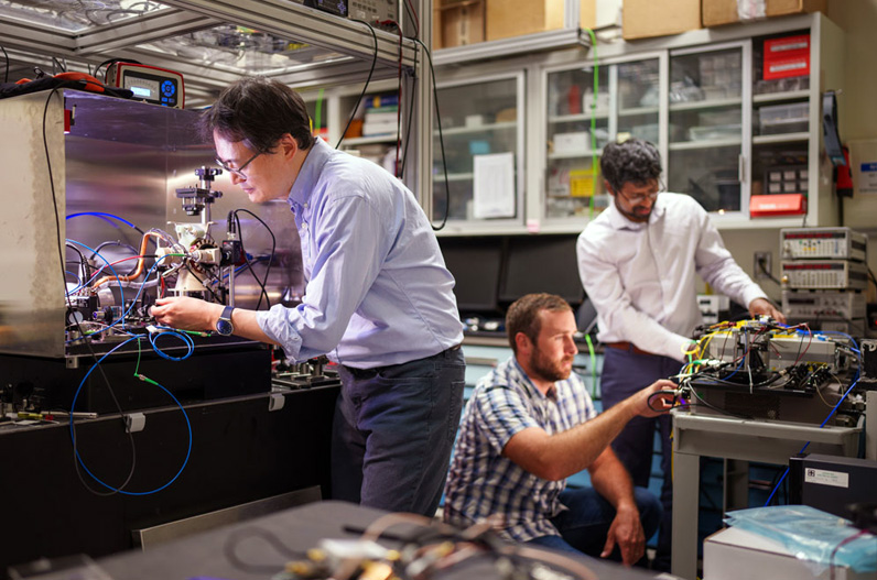 Sandia scientists prepare a rubidium cold-atom cell for an interferometry experiment. Sandia scientists prepare a rubidium cold-atom cell for an interferometry experiment.
