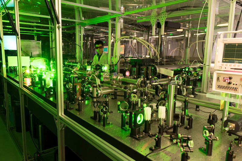 Shoujun Wang researching high energy density laser-created plasma.