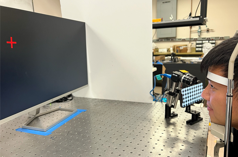 Jiazhang Wang demonstrates the experimental setup.