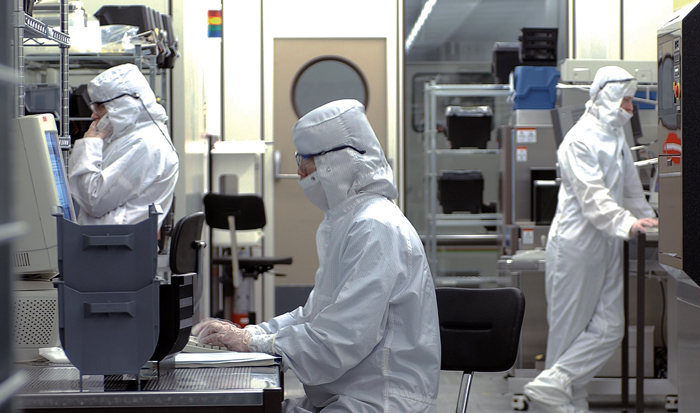 Imec researchers developing the new backlit CMOS sensor.