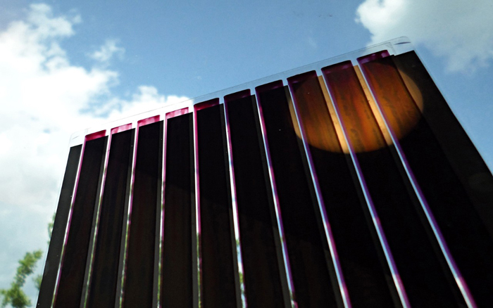 Organic photovoltaics printed on ultra-thin glass.