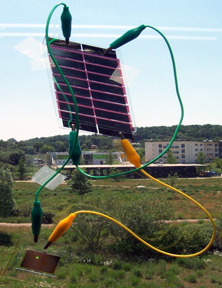 A two-sided silicon solar cell illuminated by an infrared laser.