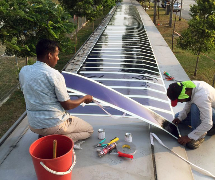 Power walking: Heliatek film is fitted to a covered walkway at Singapore's Seletar Airport.