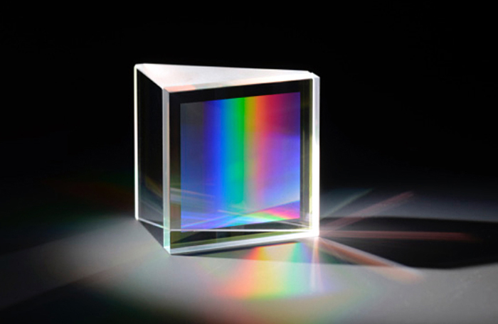 Directly bonded fused silica GRISM (grating + prism).