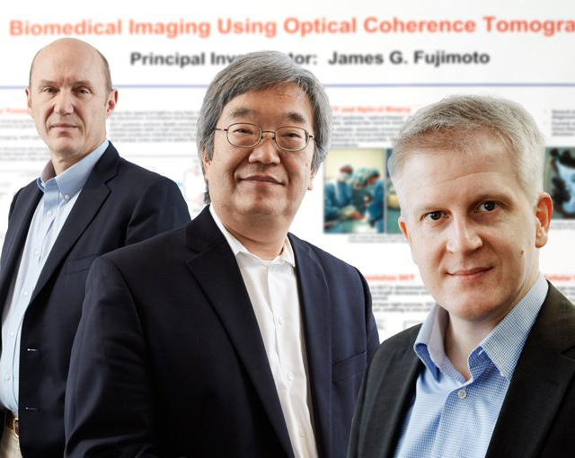 James G. Fujimoto (center) with Eric A. Swanson (L) and Robert Huber (R).