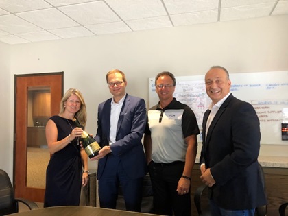 Prost! Prodomax and Jenoptik Group CEOs toast the deal.