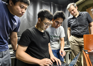 Xiaochun Liu, Ji-Hyun Nam and Toan Le work with Prof. Andreas Velten (R).