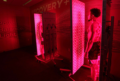 Red and red: 49ers Fred Warner and K’Waun Williams using light therapy room. 