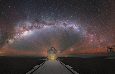 The Milky Way stretched out behind one of the Auxiliary Telescopes of ESO's VLT.