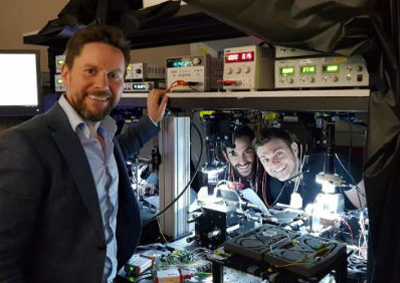 Researchers at QETLabs working on silicon quantum photonics. Click for info.