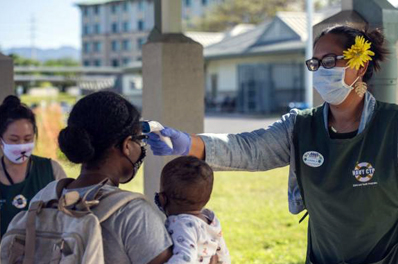 Temperature checks are conducted at the US Navy base in Hawaii. 