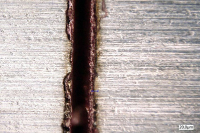 Kerf produced by helical cutting on a metal sheet. 