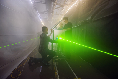 Sanchez, Wright, and Bentz prepare for an optical test in Sandia Labs’ fog facility.