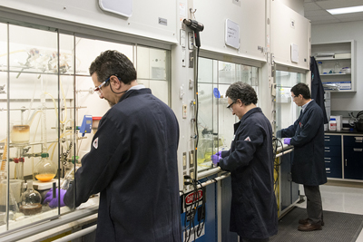 Universal Display chemists developing new OLED materials in the lab.