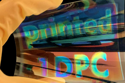 Colored, printed mirror layer on a film.