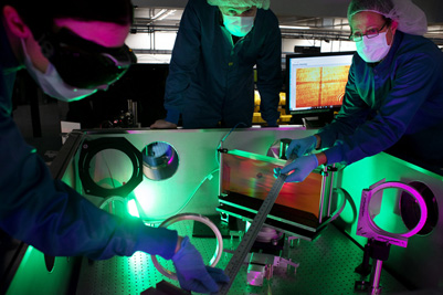 Researchers at the NSF ZEUS laser facility in a Michigan Engineering lab.