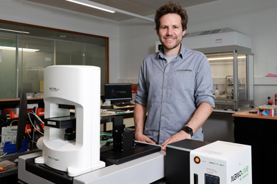 Yann Cotte with a microscope developed by his startup Nanolive.