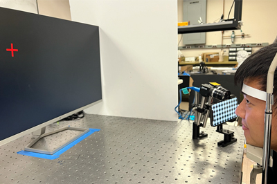 Jiazhang Wang demonstrates the experimental setup.