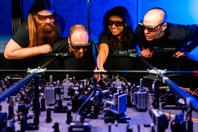 Nico Hauser (left) with other researchers from the Barz group.