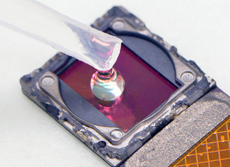A test sample is placed directly onto the surface of the (cellphone's) image sensor.