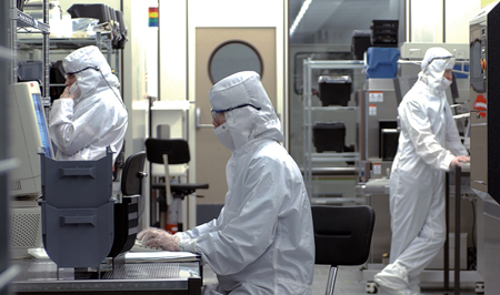 Imec researchers developing the new backlit CMOS sensor.