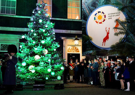 Lighten up: David Cameron, UK Prime Minister (center) cannot wait for 2015. 