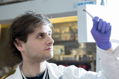 Warwick PhD student Kenny Marshall with a lead free solar cell.