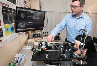 Marinko Sarunic demonstrates his new retinal imaging scanner.