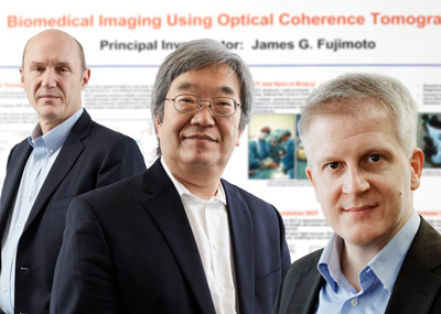 James G. Fujimoto (center) with Eric A. Swanson (L) and Robert Huber (R).